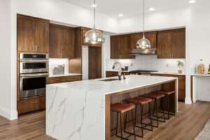 waterfall island, engineered flooring , undermount sink, quartz tops